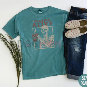 "Staying Alive" Coffee T-Shirt – Funny Skeleton Tee, Trendy Retro Halloween, Women's Comfort Colors Shirt — view 2
