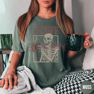 "Staying Alive" Coffee T-Shirt – Funny Skeleton Tee, Trendy Retro Halloween, Women's Comfort Colors Shirt — view 3