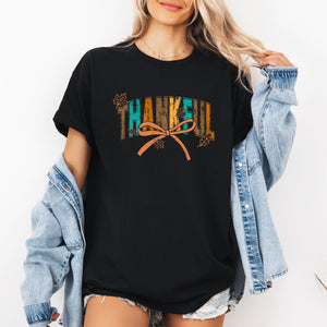 Thankful Fall Autumn Bow Ribbon Harvest Moon Halloween Whimsy Cozy Seasonal Delight Graphic Tee — view 1