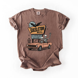 The Skeleton Motel Reading Skeletons Spooky Halloween Graphic Comfort Colors Tee — view 1