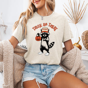 Trick Or Treat, Feral Raccoon Halloween Mischief Edition Spooky Nighttime Vibes Graphic Tee — view 1